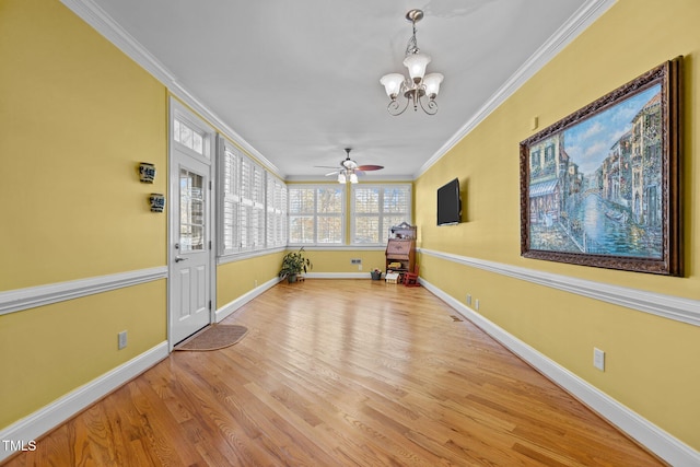 interior space featuring ceiling fan with notable chandelier