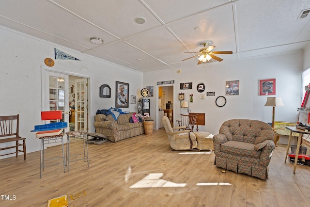 living room with ceiling fan and light hardwood / wood-style floors