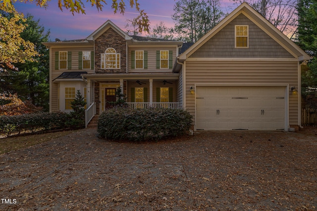 view of front of home with a garage and covered porch