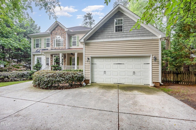 1620 Dunn Rd, Raleigh, NC 27614 - traditional-style house with covered porch, concrete driveway, fence, and an attached garage