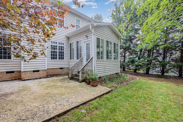 1620 Dunn Rd, Raleigh, NC 27614 - rear view of property with crawl space, a patio, a sunroom, and a lawn