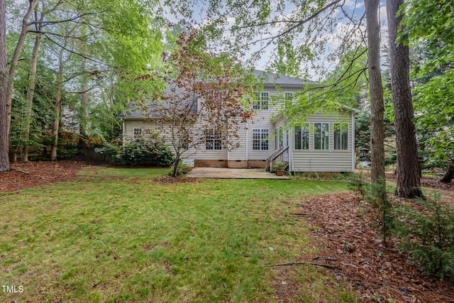 1620 Dunn Rd, Raleigh, NC 27614 - rear view of house with crawl space, a patio area, a lawn, and a sunroom