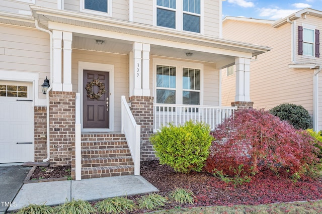 doorway to property with covered porch