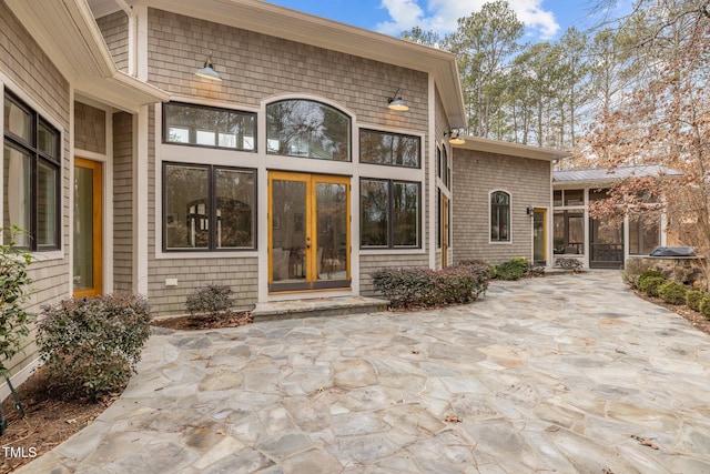 doorway to property with a patio