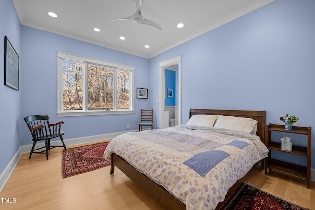 bedroom with ceiling fan, ornamental molding, and light wood-type flooring