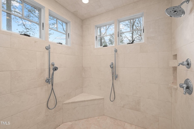 bathroom with a tile shower