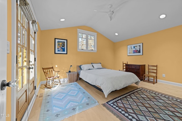 bedroom featuring vaulted ceiling and light wood-type flooring