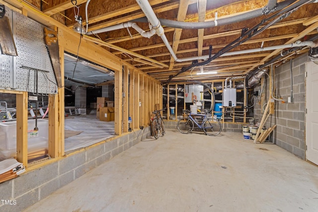 basement featuring tankless water heater