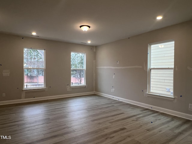 empty room with dark hardwood / wood-style floors