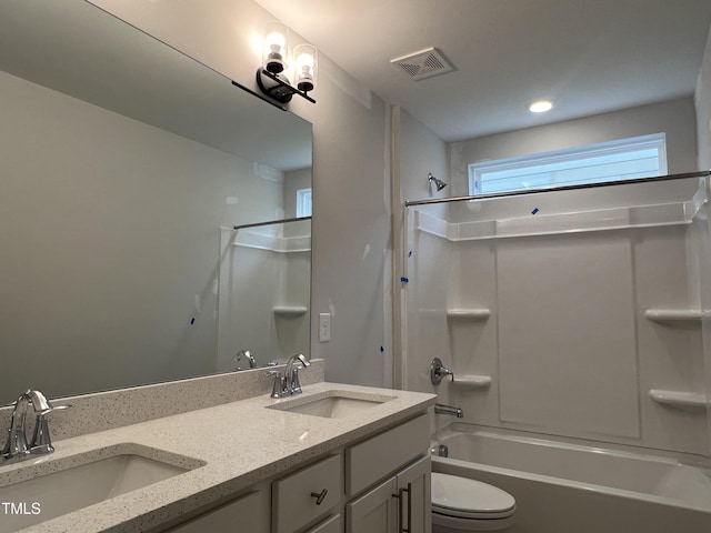 full bathroom featuring toilet, tub / shower combination, and vanity