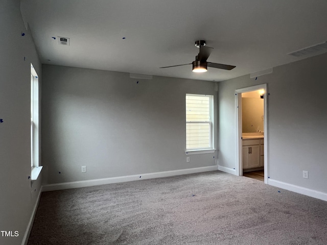 carpeted empty room featuring ceiling fan