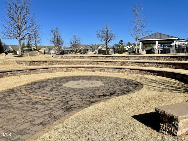 view of yard featuring a gazebo, a patio area, and a residential view