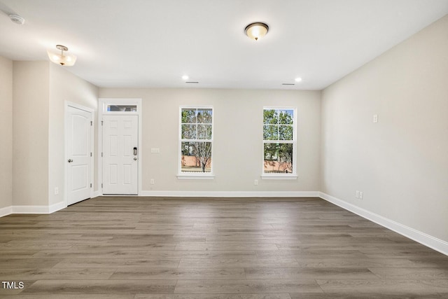 foyer featuring dark wood-style floors, baseboards, and recessed lighting