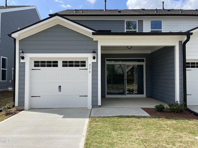 view of front of house featuring driveway and a garage