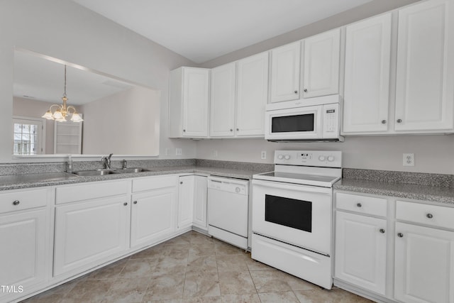 kitchen featuring sink, hanging light fixtures, a notable chandelier, white appliances, and white cabinets