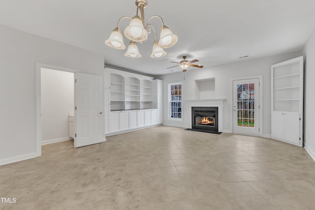 unfurnished living room with ceiling fan with notable chandelier and light tile patterned floors