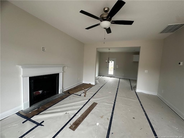 unfurnished living room featuring ceiling fan