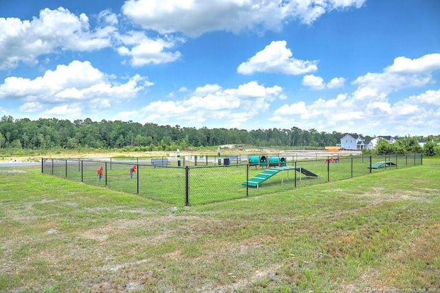 view of yard featuring fence and a rural view