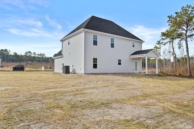 back of house featuring central AC unit