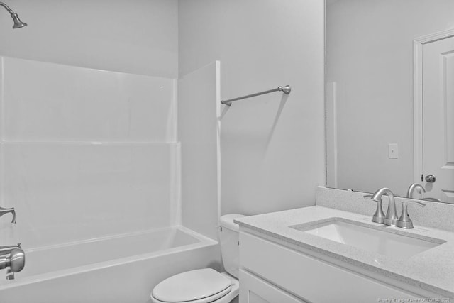 bathroom with toilet, bathing tub / shower combination, and vanity