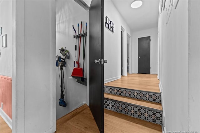 corridor with light hardwood / wood-style flooring