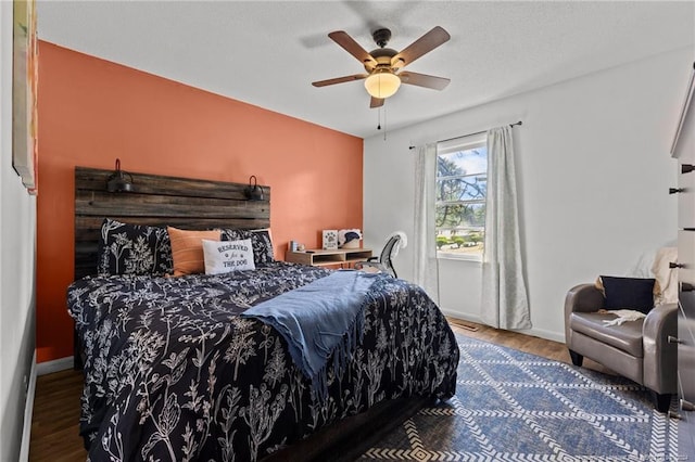 bedroom with hardwood / wood-style flooring and ceiling fan