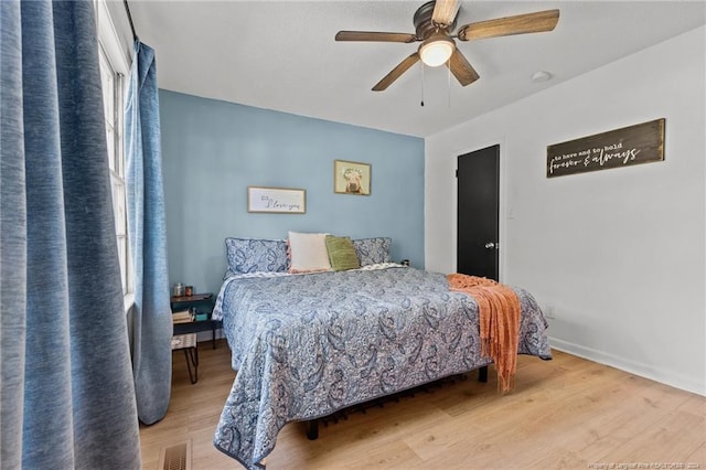 bedroom featuring light hardwood / wood-style flooring and ceiling fan