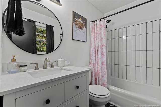 full bathroom with vanity, shower / tub combo, and toilet