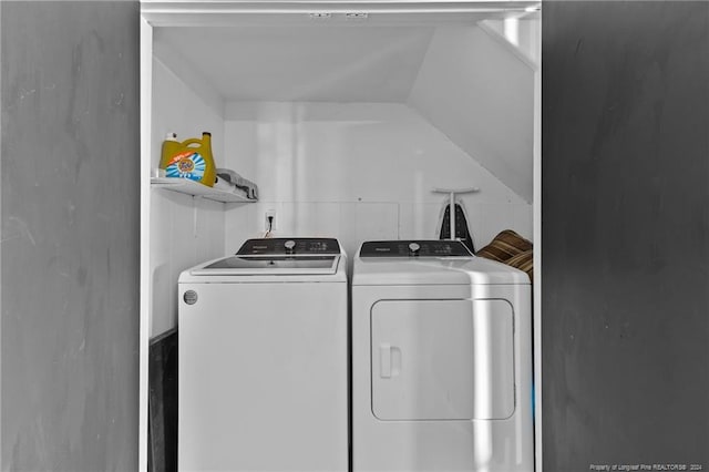 laundry room featuring washing machine and clothes dryer