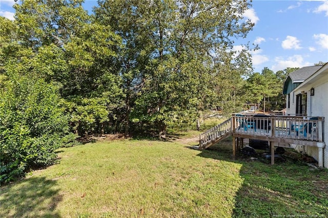 view of yard with a wooden deck