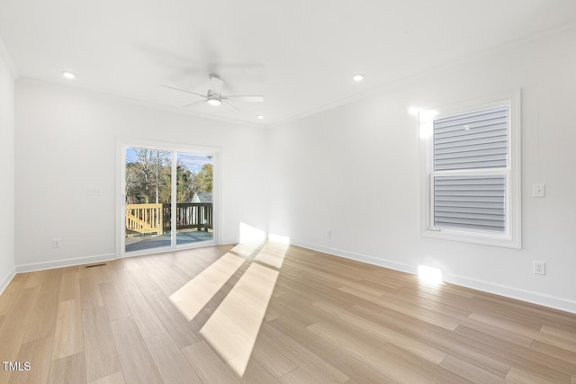 empty room featuring ceiling fan, crown molding, and light hardwood / wood-style flooring