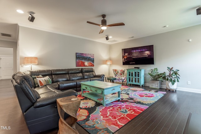 living room featuring crown molding, dark hardwood / wood-style flooring, and ceiling fan