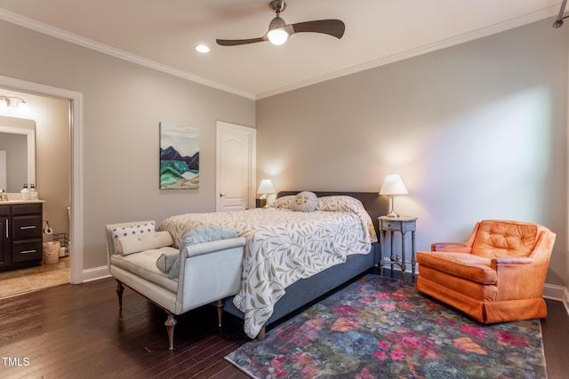 bedroom featuring ceiling fan, crown molding, dark wood-type flooring, and connected bathroom