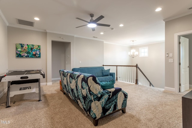 carpeted living room featuring crown molding and ceiling fan with notable chandelier