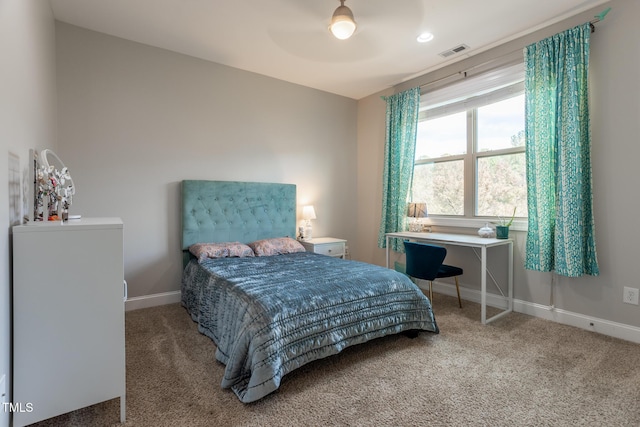 carpeted bedroom with ceiling fan