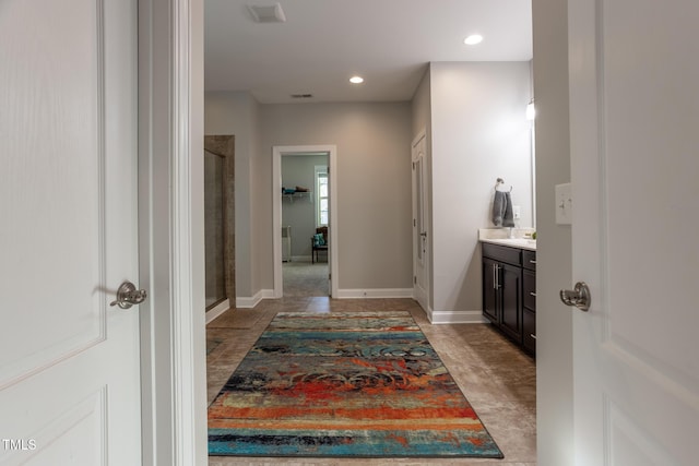 bathroom with vanity and walk in shower