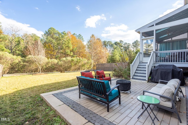 wooden terrace with area for grilling, outdoor lounge area, a yard, and a sunroom