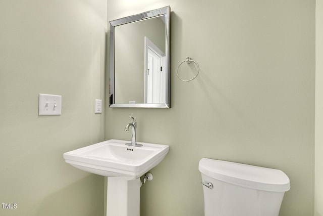 bathroom with toilet and sink