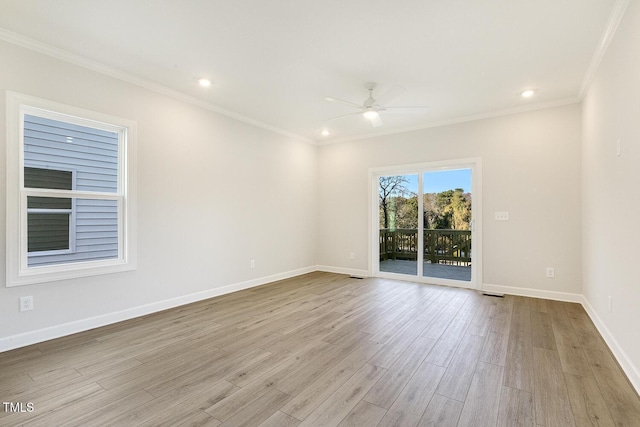 empty room with light wood-type flooring, ceiling fan, and crown molding