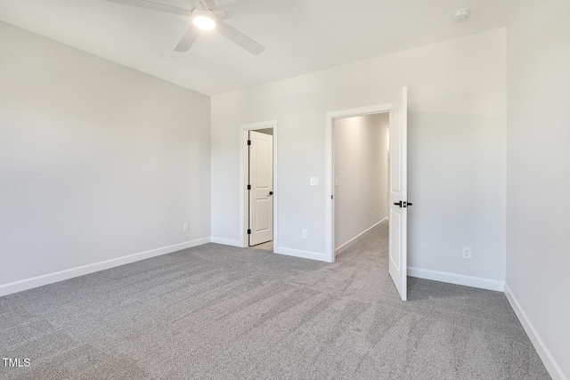 carpeted empty room with ceiling fan