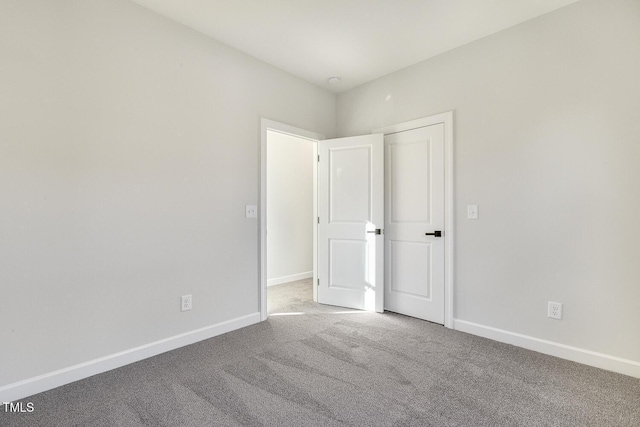 empty room featuring carpet flooring