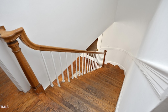 stairway featuring hardwood / wood-style floors