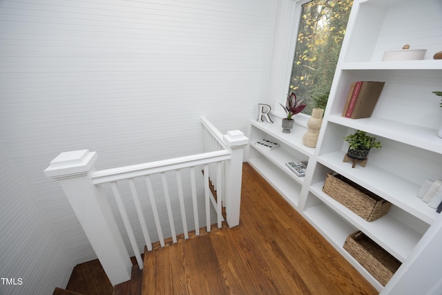 staircase with wood-type flooring