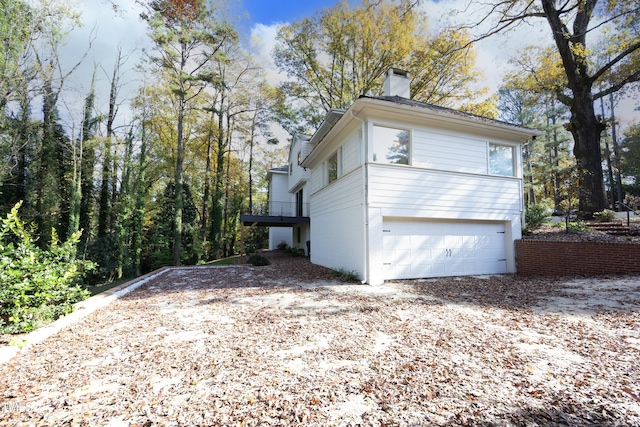 view of side of property with a garage