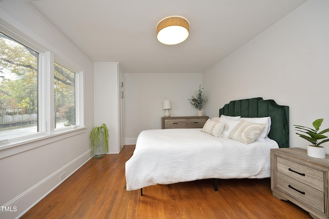 bedroom featuring dark hardwood / wood-style floors