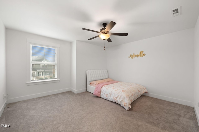 bedroom with ceiling fan and light colored carpet