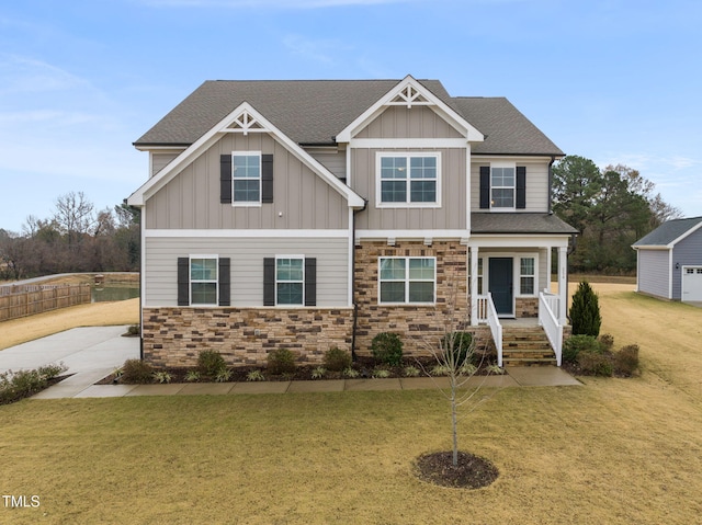 craftsman inspired home with a front lawn