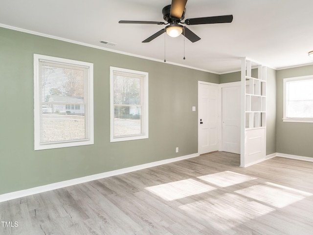 unfurnished bedroom with light hardwood / wood-style flooring, ceiling fan, and ornamental molding