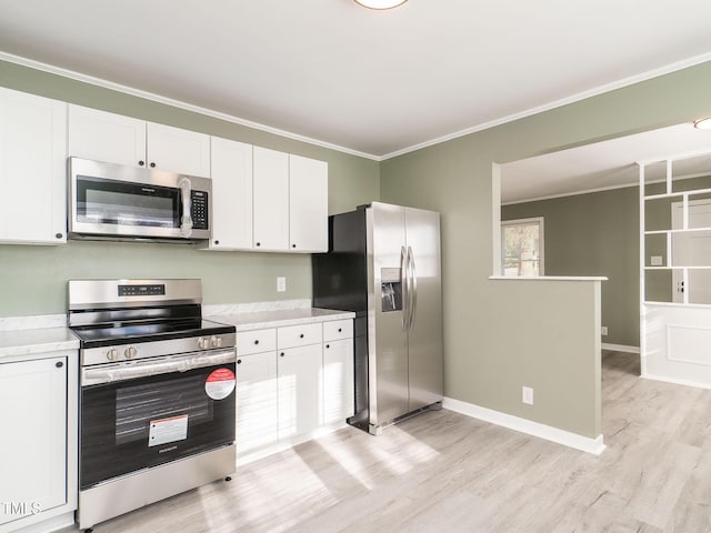 kitchen featuring appliances with stainless steel finishes, light hardwood / wood-style flooring, white cabinetry, and ornamental molding