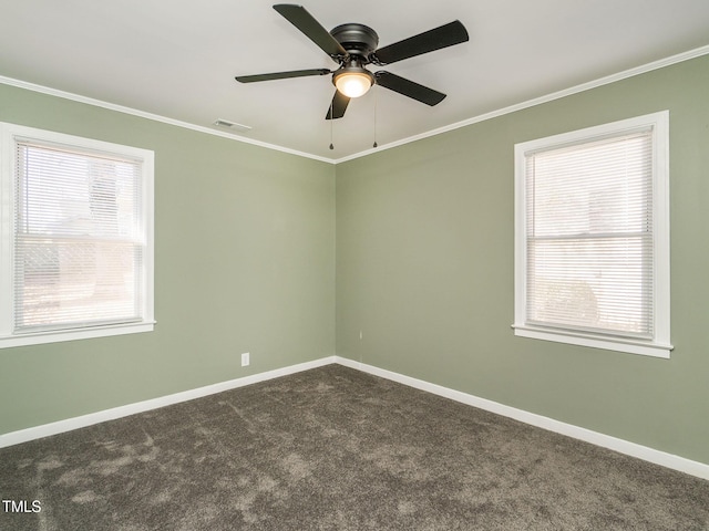 carpeted spare room featuring ceiling fan and ornamental molding